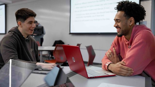 Students collaborate in a business class at Pacific University