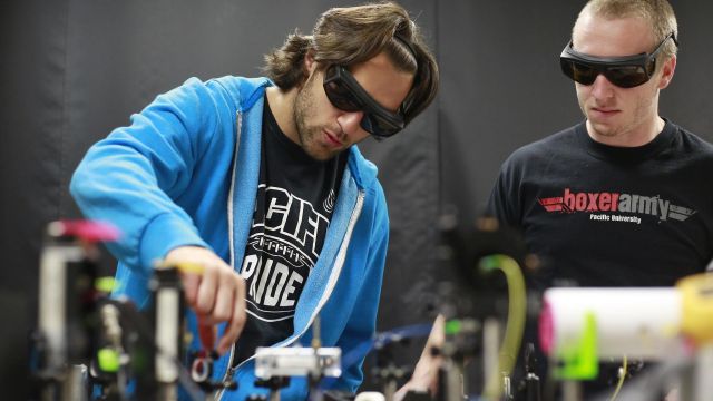 A faculty member and a student work in the Pacific physics lab