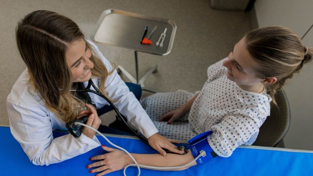 Julia Senestraro '21, PA '25 practices caring for a patient