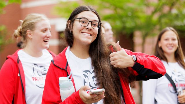 A Pacific University student gives a thumbs up