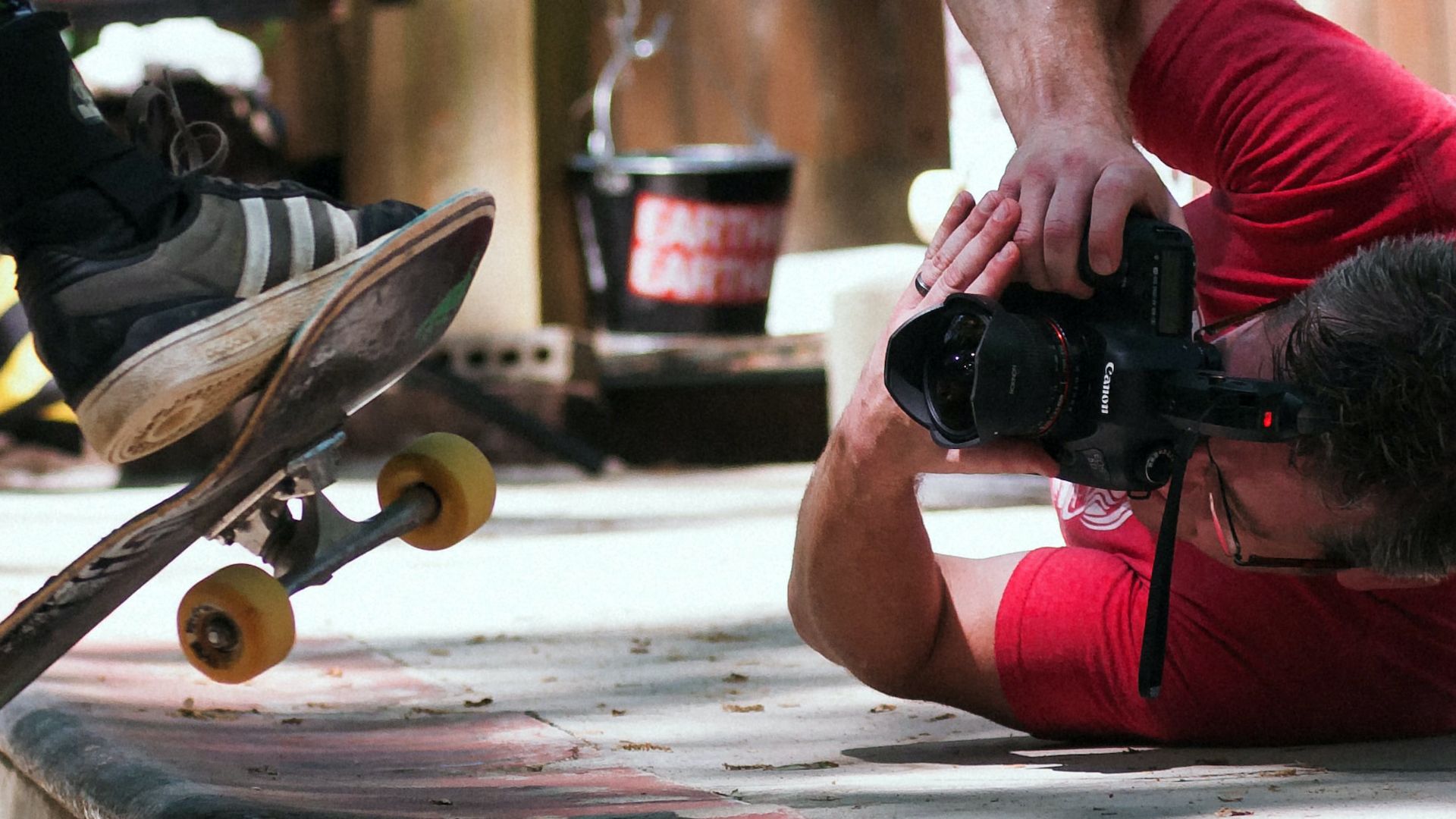 Man doing photography of a person skateboarding