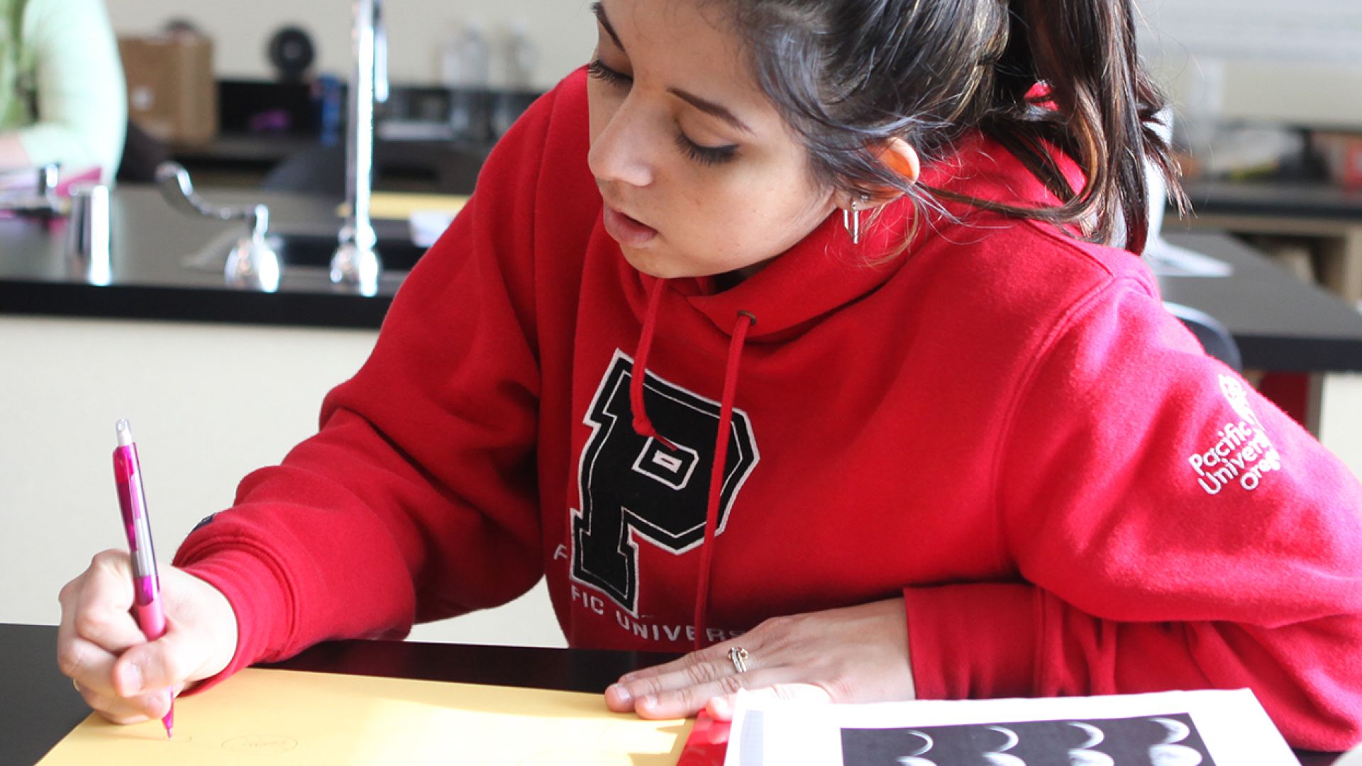 student studying in classroom setting